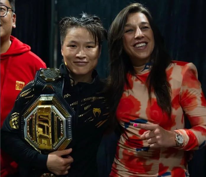 com, 目的比赛, 对于张伟丽